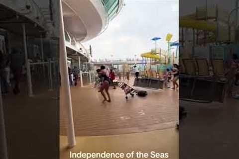 Royal Caribbean cruise ship passengers run for cover as storm batters deck furniture